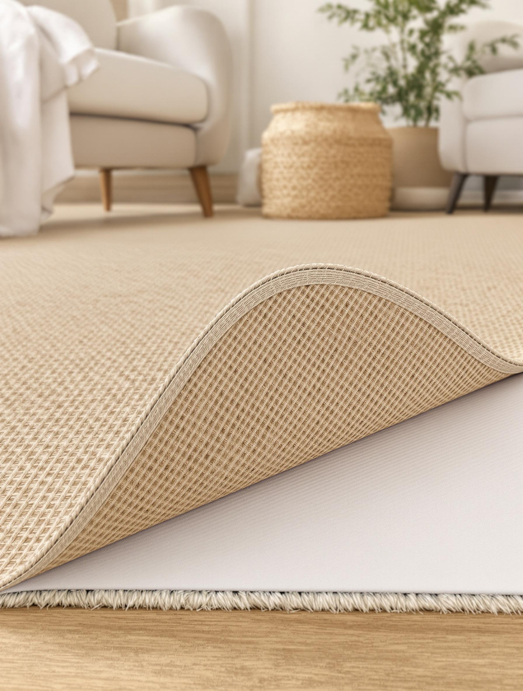 Sous-tapis antidérapant utilisé sous un tapis en jute, méthode professionnelle de fixation